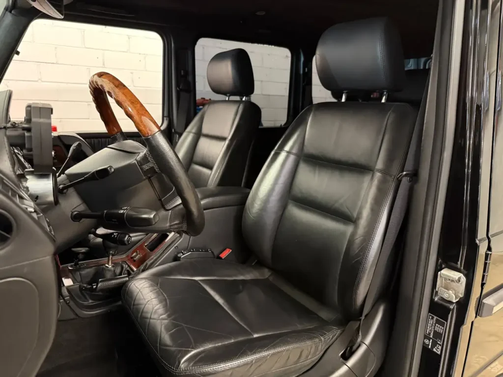 Mercedes Benz G55 AMG schwarz Foto vom Fahrersitz.