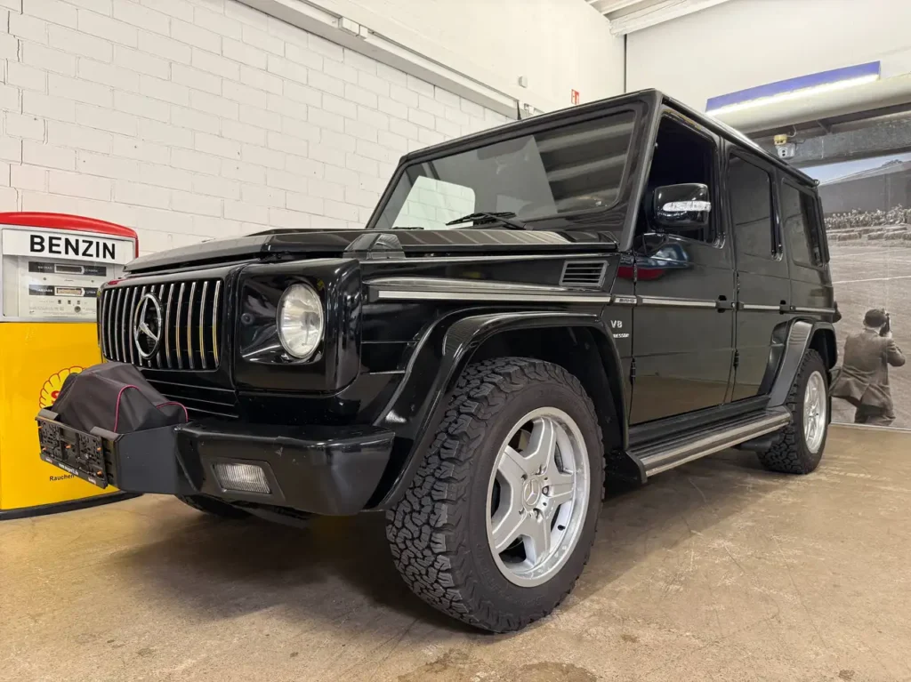 Mercedes Benz G55 AMG schwarz Foto vom linken Kotfluegel Fahrerseitig vorne.